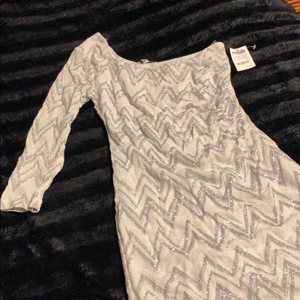 White and silver sparkly dress.